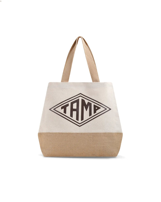 Heavy duty canvas and jute shopper with brown arpillera base, white fabric, brown handles, and black Tamp Coffee logo in center