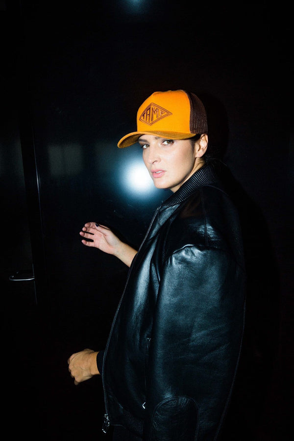 Artist Jana Kirschner wearing a trucker cap from Tamp Apparel